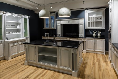 Custom kitchen with dark cabinetry and a stone-topped island